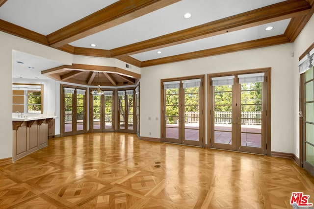 doorway to outside featuring beamed ceiling, sink, light parquet floors, crown molding, and french doors