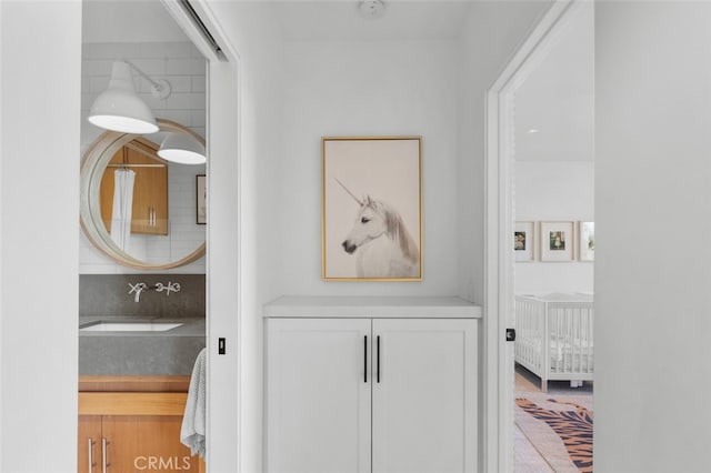 interior space with decorative backsplash and vanity