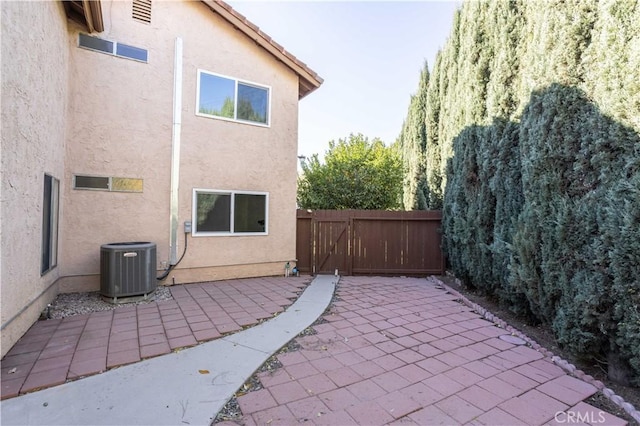 exterior space featuring a patio area and central air condition unit