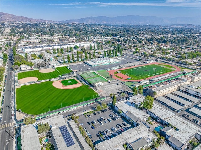 birds eye view of property with a mountain view