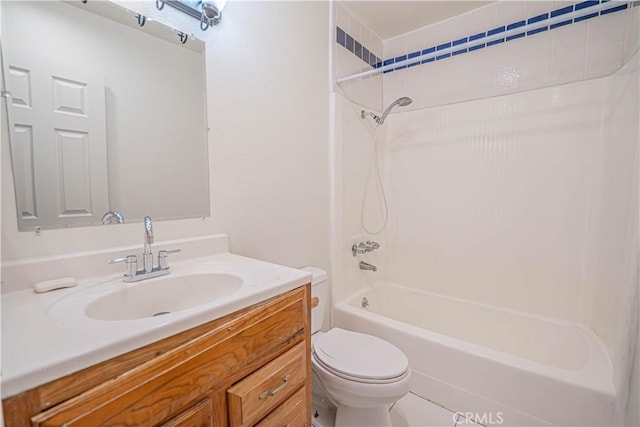 full bathroom featuring tub / shower combination, toilet, and vanity