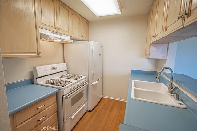 kitchen with sink, white range with gas cooktop, light wood-type flooring, and light brown cabinets