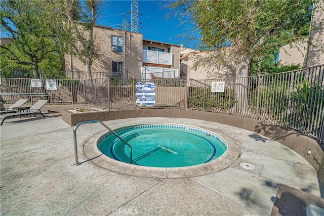 view of pool featuring a hot tub