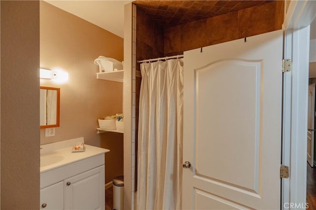 full bathroom featuring vanity and curtained shower