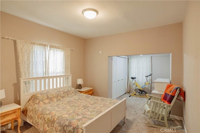 carpeted bedroom with a closet