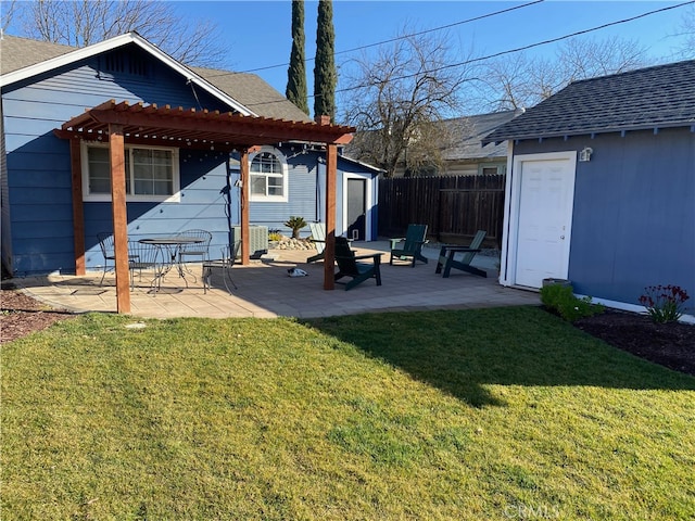 back of property featuring a patio area, a yard, a shed, and a pergola