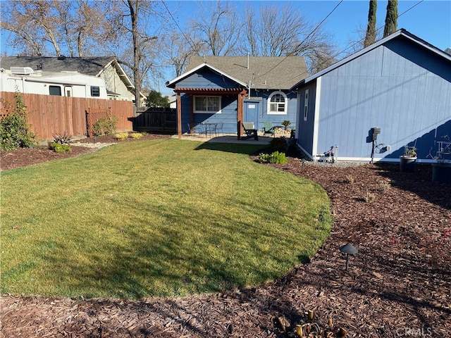 back of house with a patio, fence, and a yard
