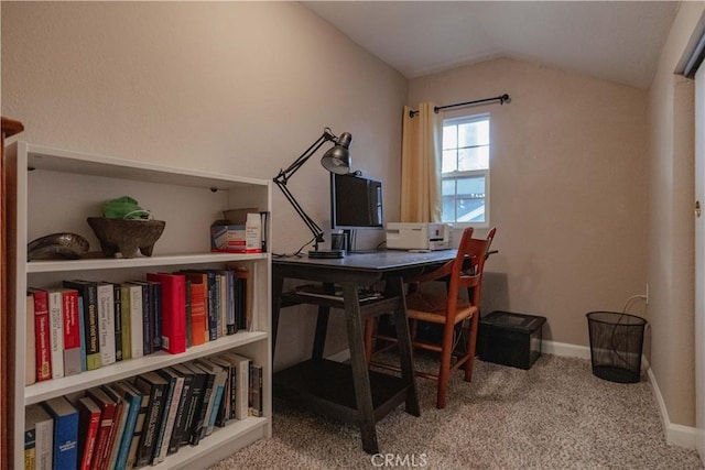 home office featuring carpet flooring, baseboards, and vaulted ceiling