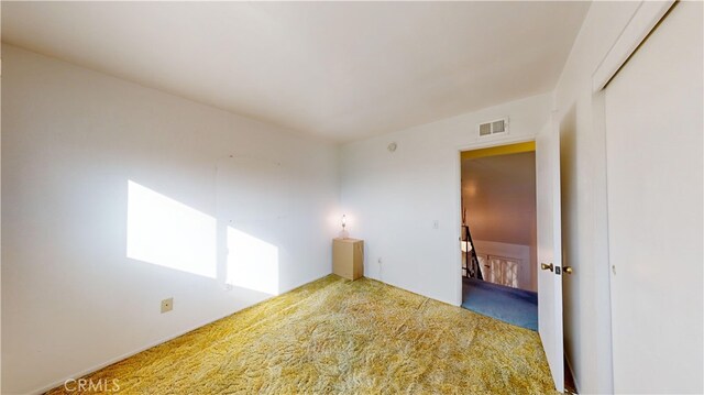 empty room with carpet flooring