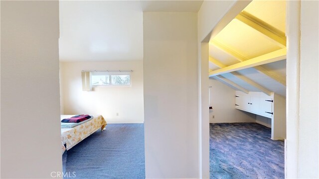 bedroom featuring dark colored carpet and vaulted ceiling with beams