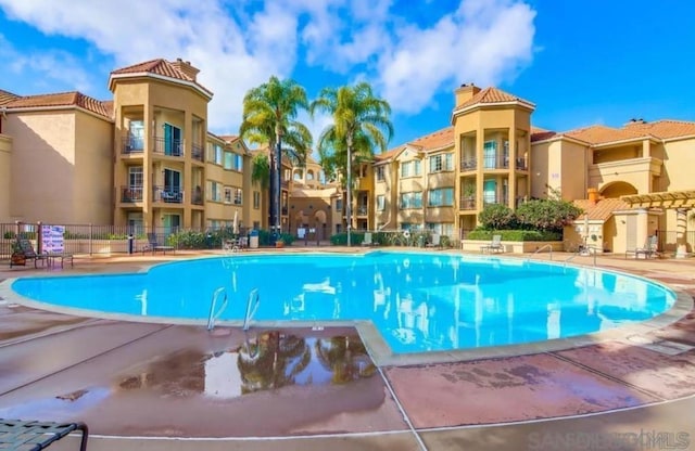 view of swimming pool featuring a patio area