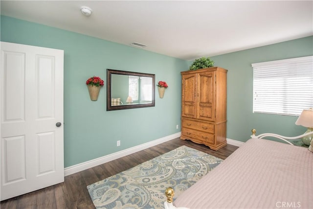 bedroom featuring dark hardwood / wood-style floors