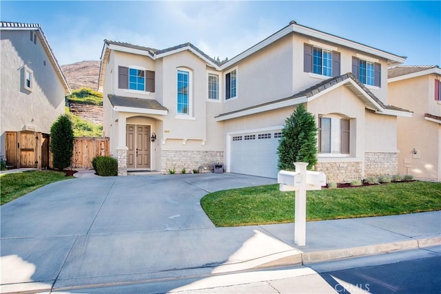 view of front of house featuring a garage and a front yard