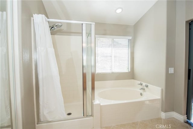 bathroom with tile patterned floors and plus walk in shower