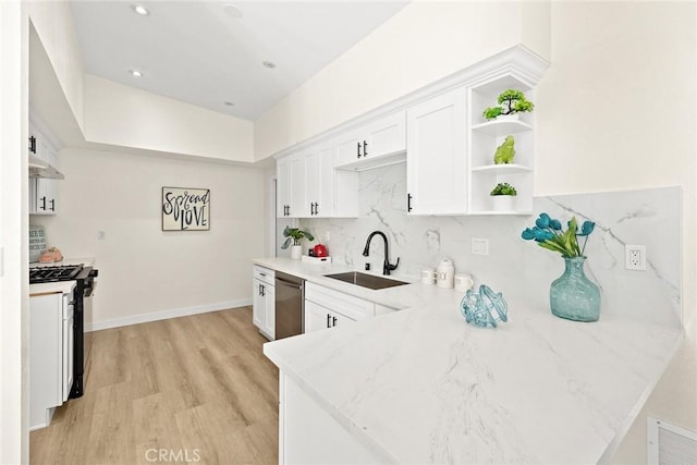 kitchen with white cabinetry, stainless steel dishwasher, gas range, sink, and light stone counters