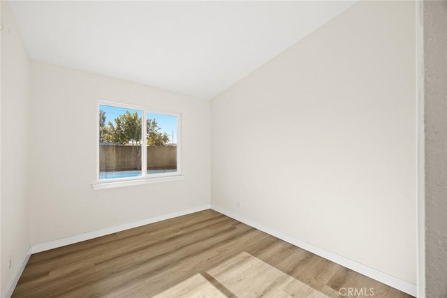 empty room featuring hardwood / wood-style floors