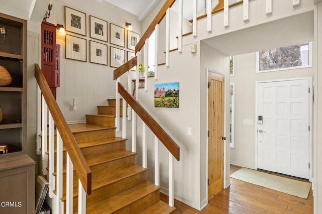 staircase with wood-type flooring