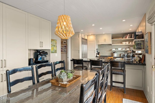 dining space with light wood-type flooring