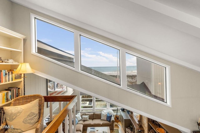 interior space featuring a water view and a beach view