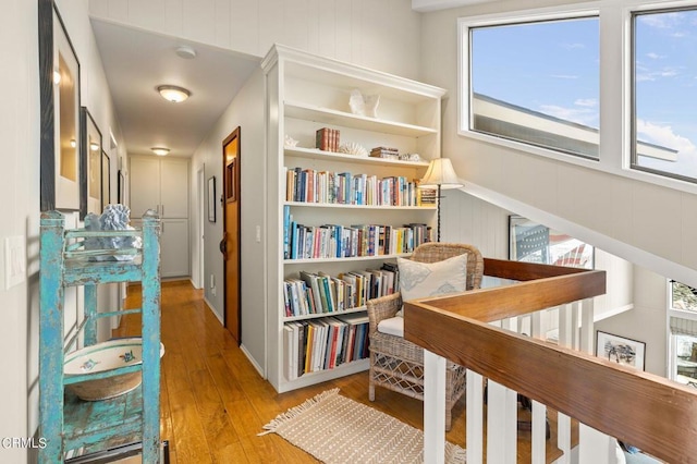 hallway with hardwood / wood-style floors