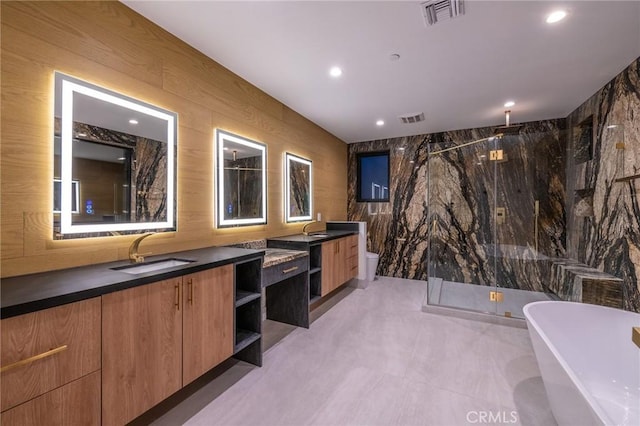 full bathroom featuring separate shower and tub, tile walls, toilet, vanity, and wood walls