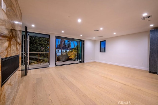 home theater room featuring light hardwood / wood-style flooring