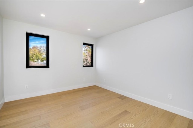 spare room featuring light wood-type flooring