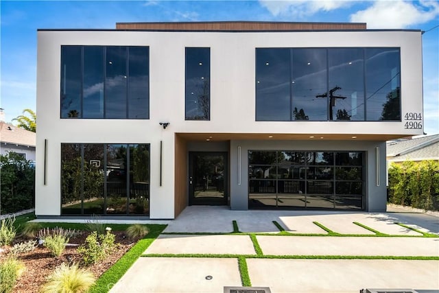 rear view of property featuring a patio area