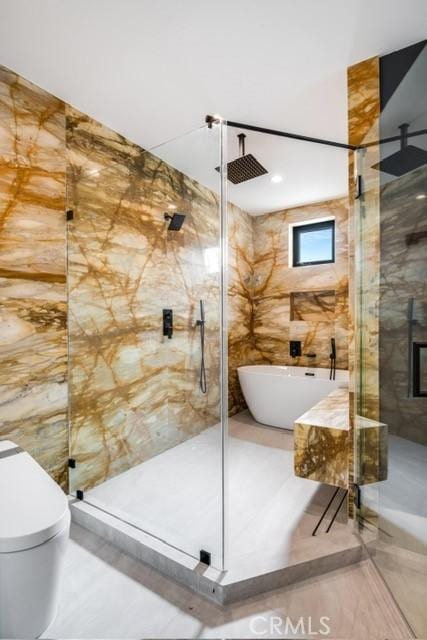 bathroom featuring independent shower and bath and tile walls