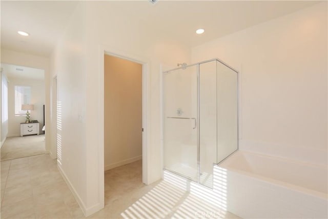 bathroom with tile patterned flooring and plus walk in shower