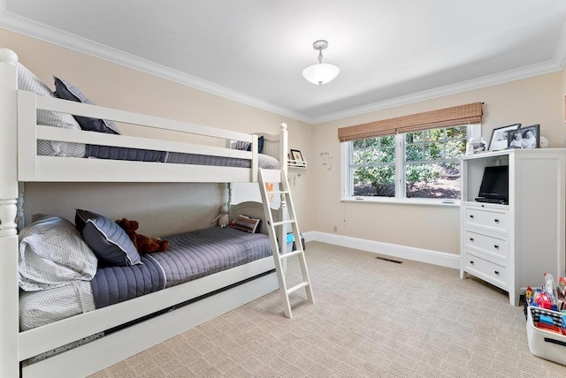 carpeted bedroom featuring crown molding