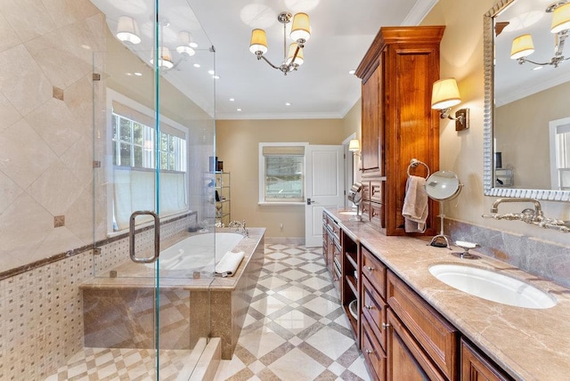 bathroom with vanity, ornamental molding, and separate shower and tub