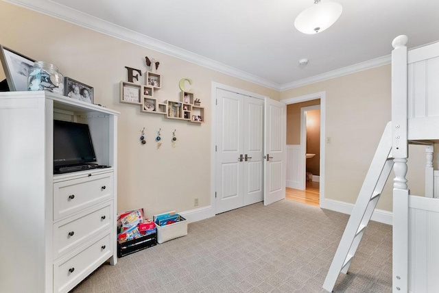 recreation room featuring light carpet and crown molding