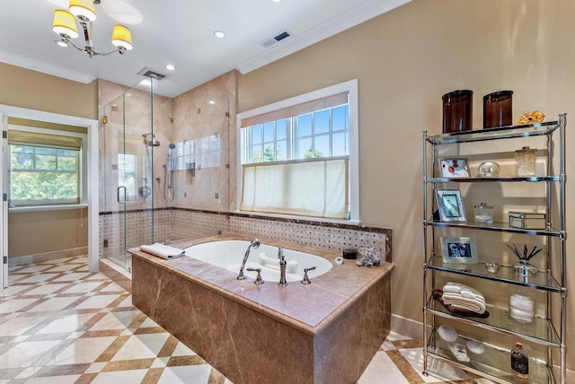 bathroom with independent shower and bath, ornamental molding, and an inviting chandelier