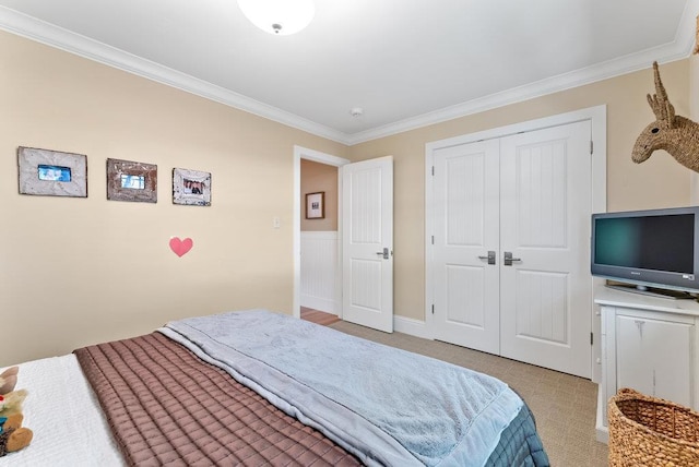 bedroom featuring ornamental molding and a closet