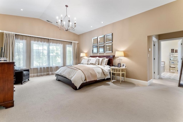 carpeted bedroom featuring vaulted ceiling, ensuite bathroom, and an inviting chandelier