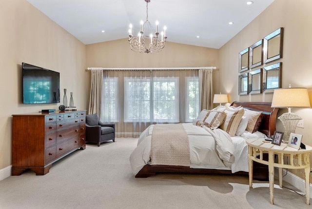 bedroom featuring light carpet, vaulted ceiling, and an inviting chandelier