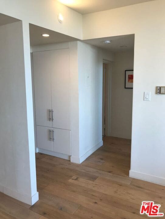 hallway featuring hardwood / wood-style flooring