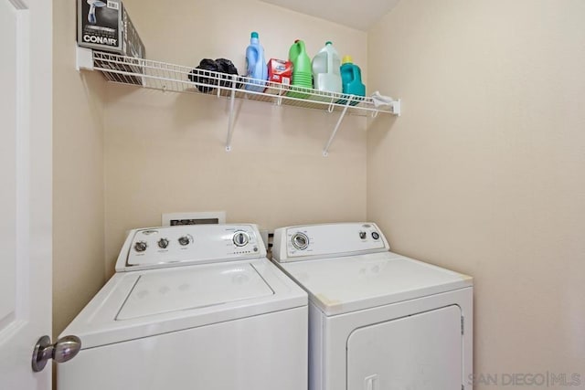 laundry room featuring separate washer and dryer