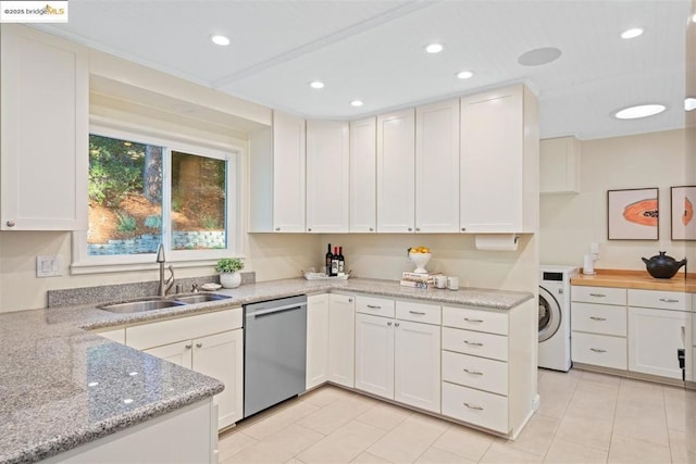 kitchen with sink, white cabinets, and dishwasher