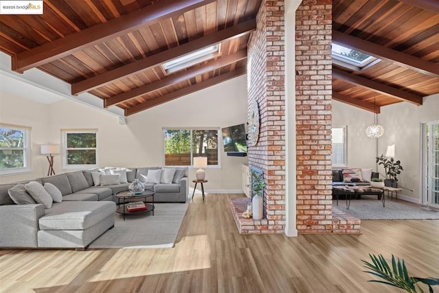 living room featuring a skylight, hardwood / wood-style floors, and plenty of natural light