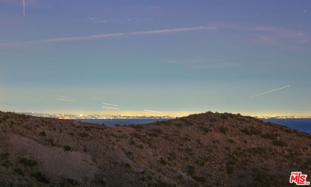 property view of mountains featuring a water view