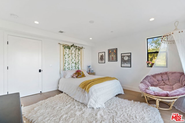 bedroom featuring hardwood / wood-style floors