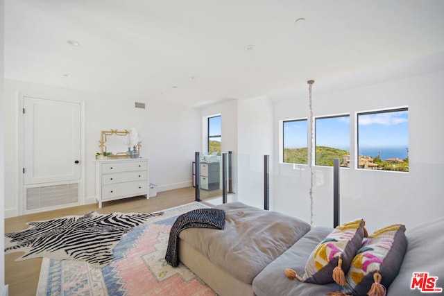 bedroom featuring light wood-type flooring