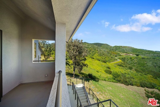 balcony featuring a mountain view