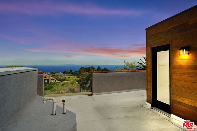 view of patio terrace at dusk