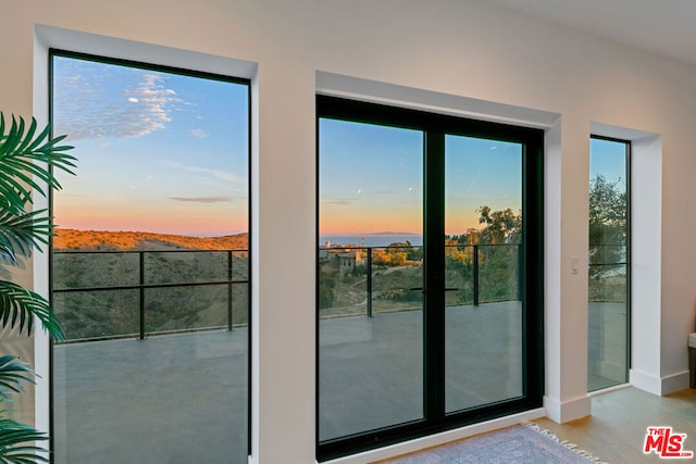 doorway with light hardwood / wood-style floors