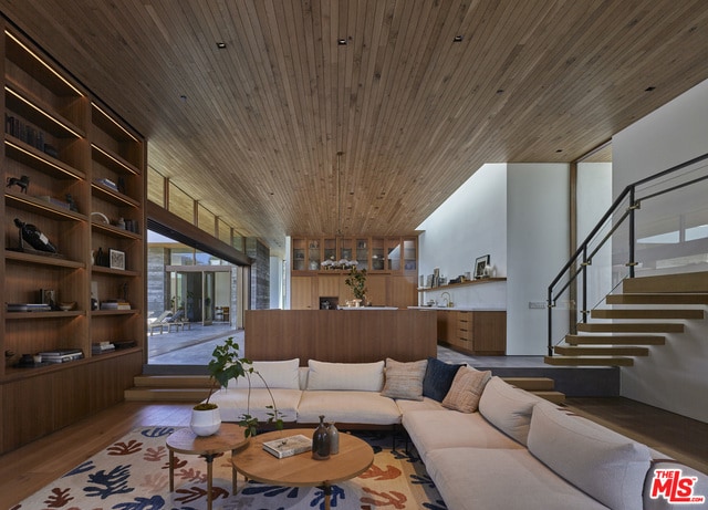 living room with plenty of natural light, wood-type flooring, and wood ceiling