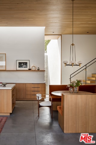 bathroom featuring vanity, concrete floors, and wooden ceiling