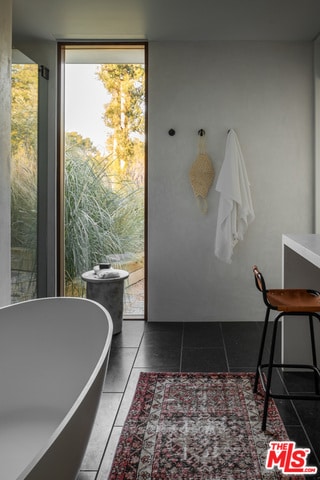 interior space featuring dark tile patterned flooring